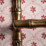 Bamboo-Toilet_paper_holder_aged_brass with roll close up