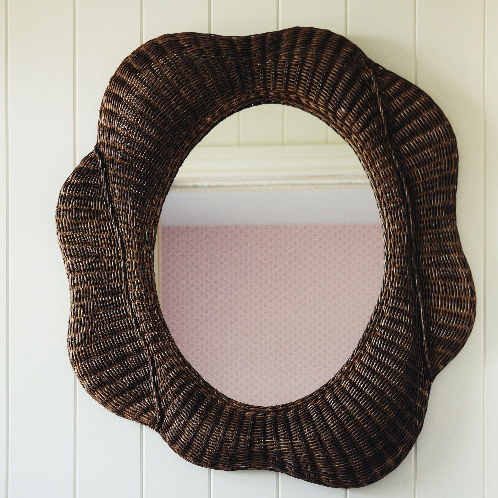 Blossom-mirror-teak-on-a-white-wall