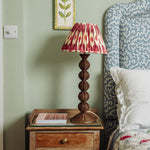 Bobbin-rattan-lamp-base-teak-on-a-side-table
