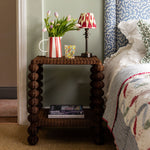 Bobbin-side-table-as-a-bedside-table-with-a-bed