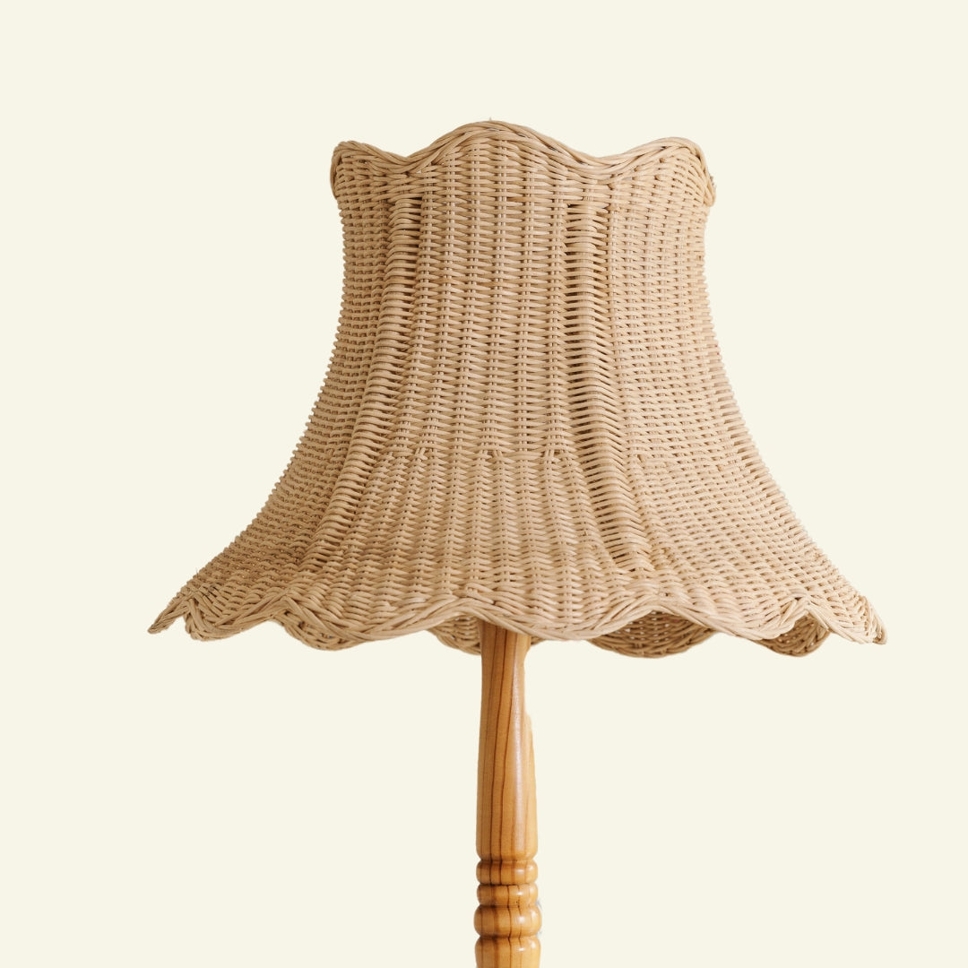 Cecelia wicker lampshade on a wooden stand against a beige background