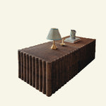 Daisy wicker coffee table with decorative items on a beige background