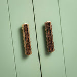 Delilah Handle Teak, Aged Brass on green