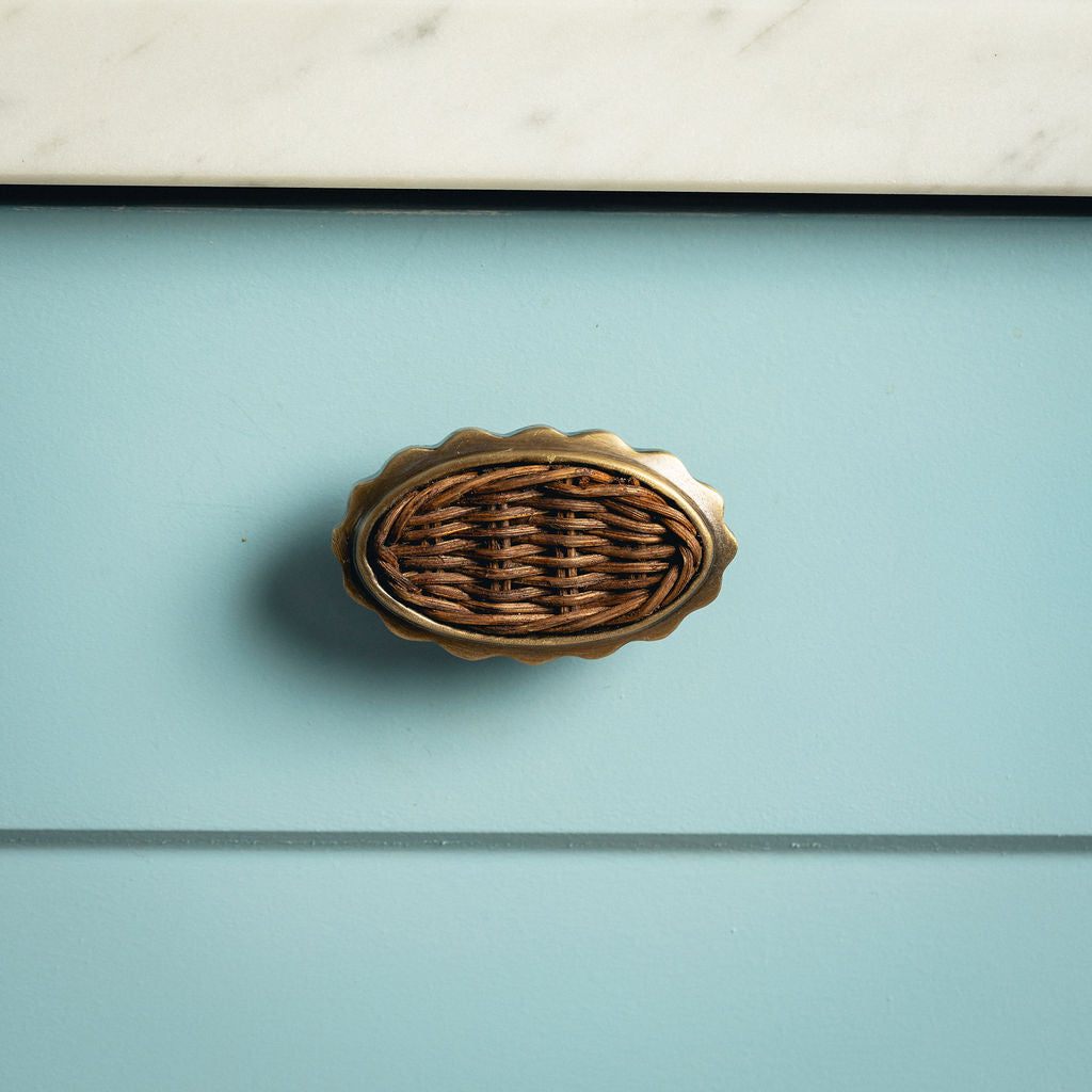Delilah Oval Knob Teak, Aged Brass on blue