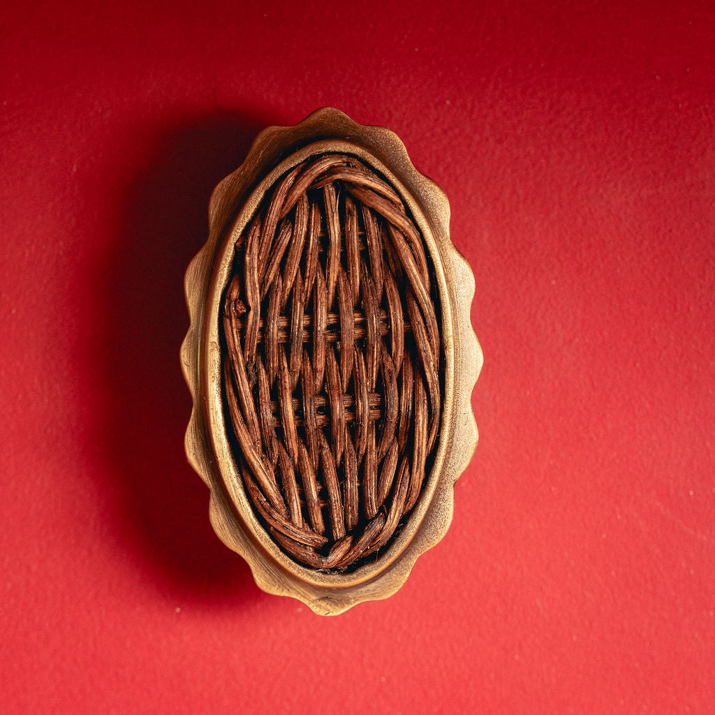 Delilah Oval Knob Teak, Aged Brass on red
