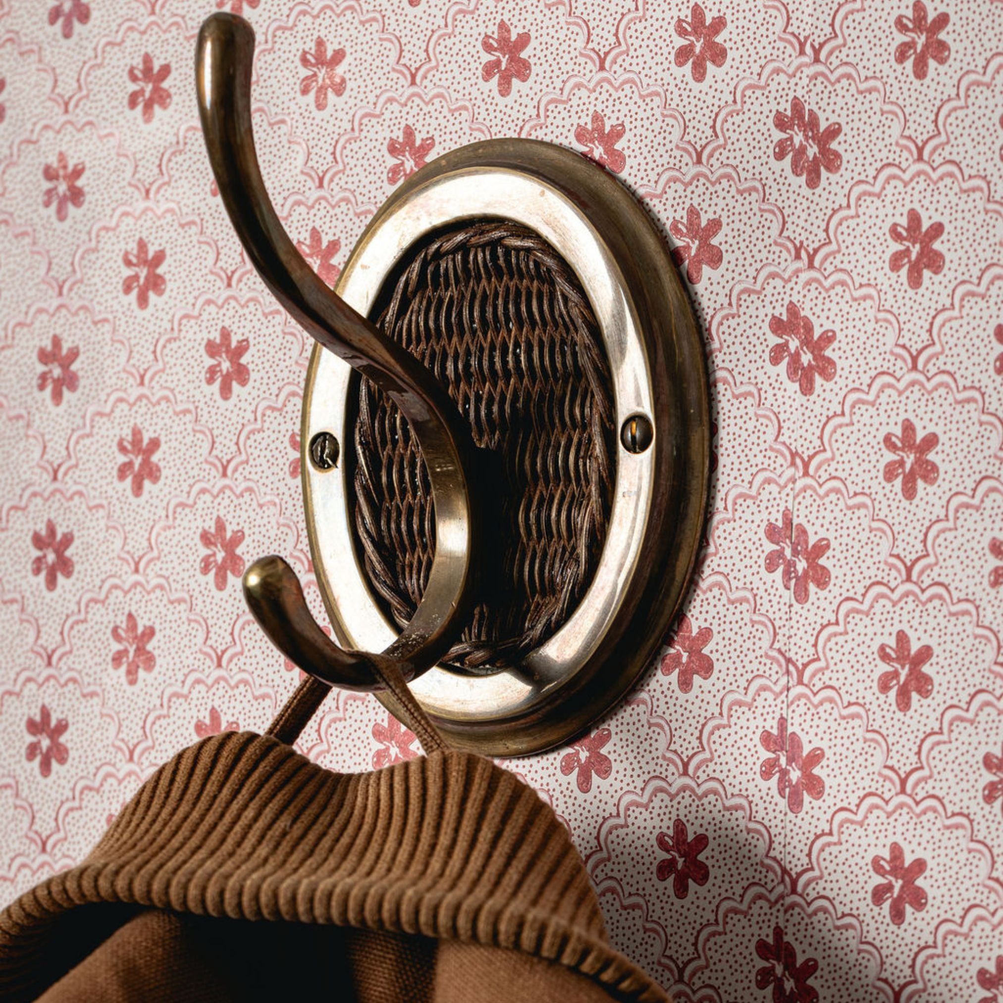 Decorative wall hook with a patterned background