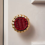 Eloise Round Knob Red, Lacquered Brass on red close up