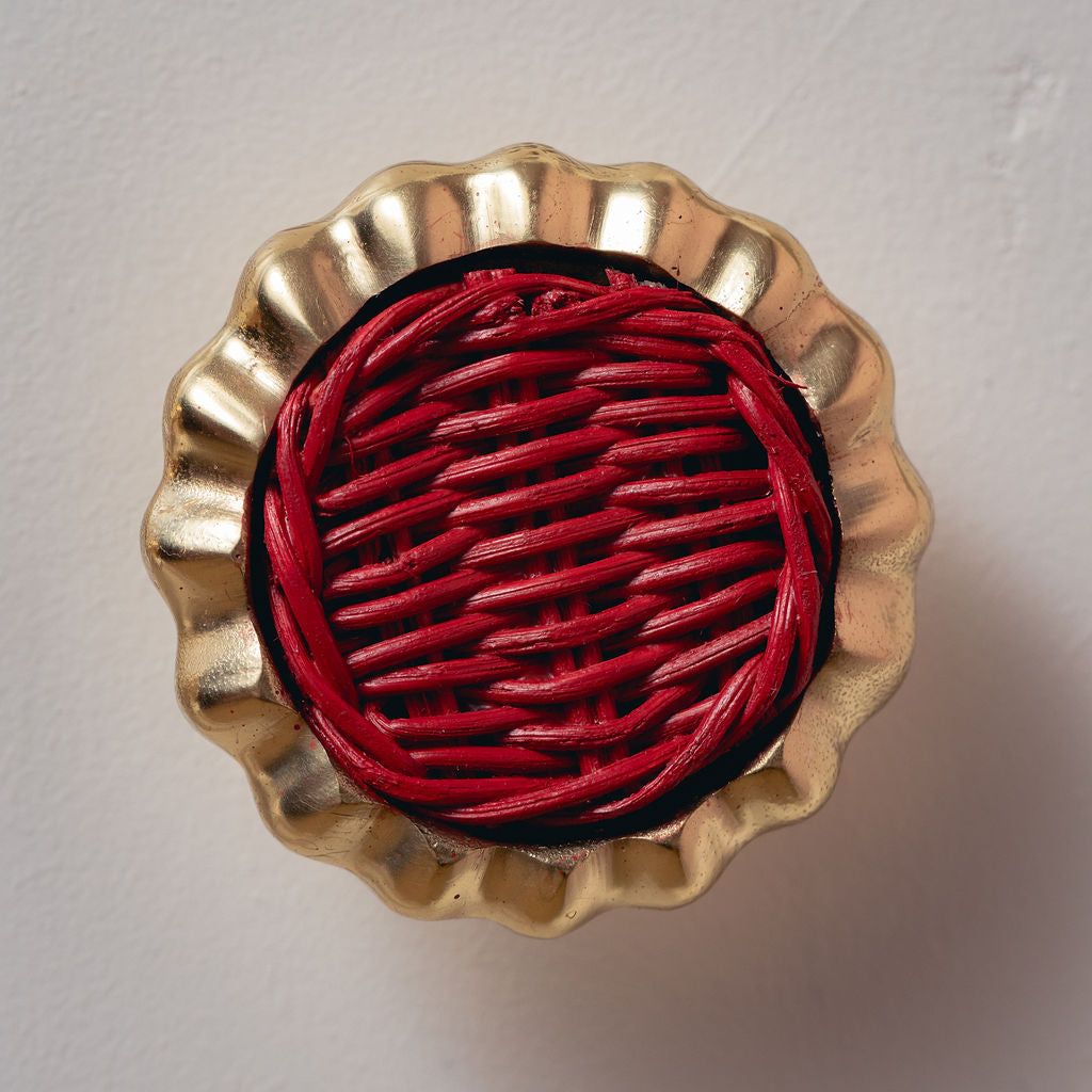 Eloise Round Knob Red, Lacquered Brass red background closeup