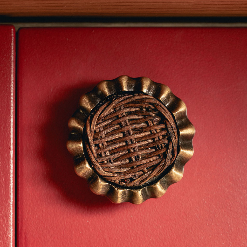Eloise Round Knob Teak, Aged Brass on blue close up