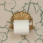 shell-brass-loo-roll-holder-on-the-wall