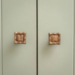 Linley-bamboo-brass-knobs-on-cabinet