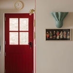 Luna-wall-light-large-light-blue-on-a-wall-with-painting