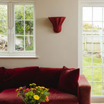 Luna-wall-light-large-red-on-a-wall-with-painting