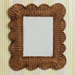 Mimi-scalloped-mirror-medium-teak-on-a-wall