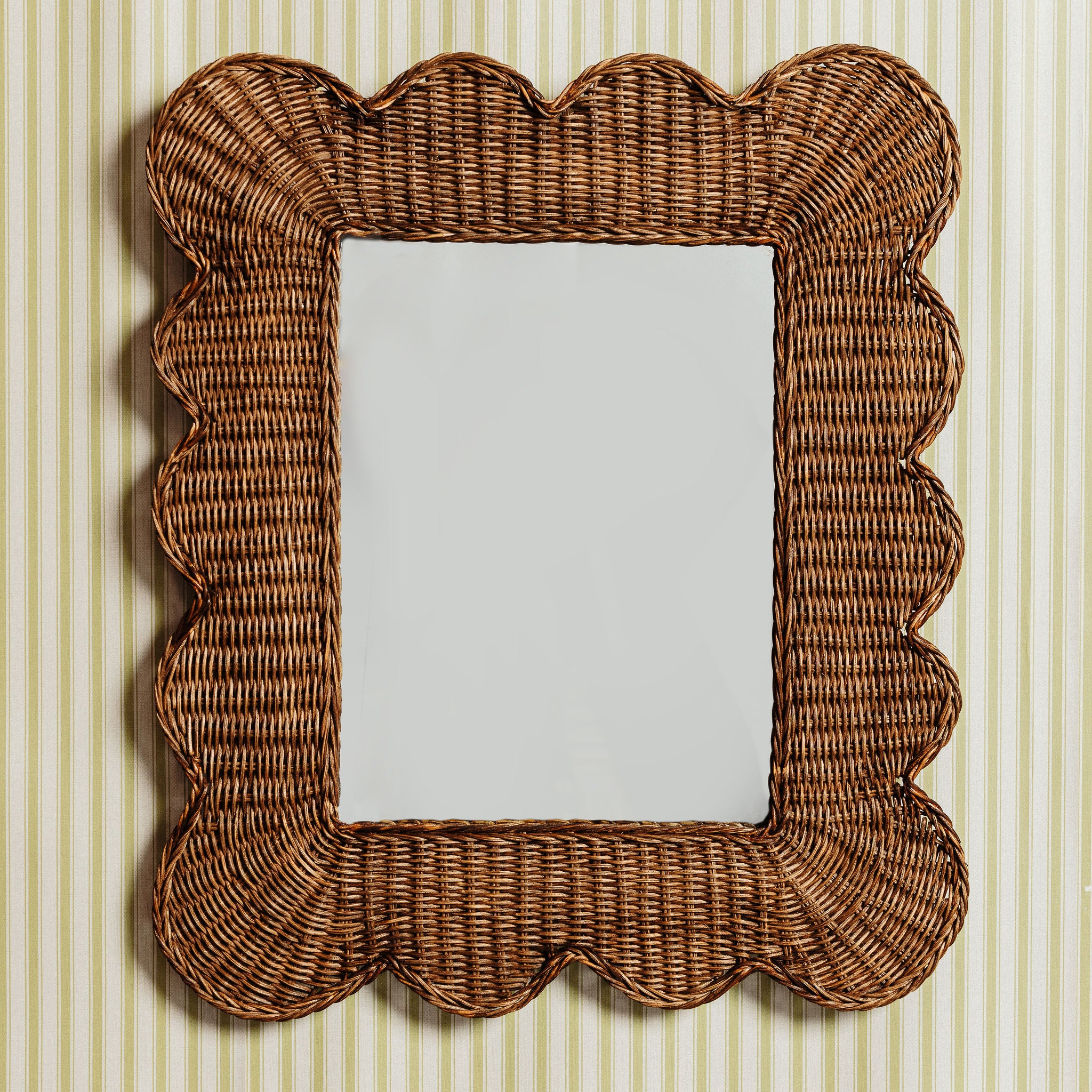 Mimi-scalloped-mirror-medium-teak-on-a-wall