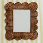 Mimi-scalloped-mirror-medium-teak-on-a-wall