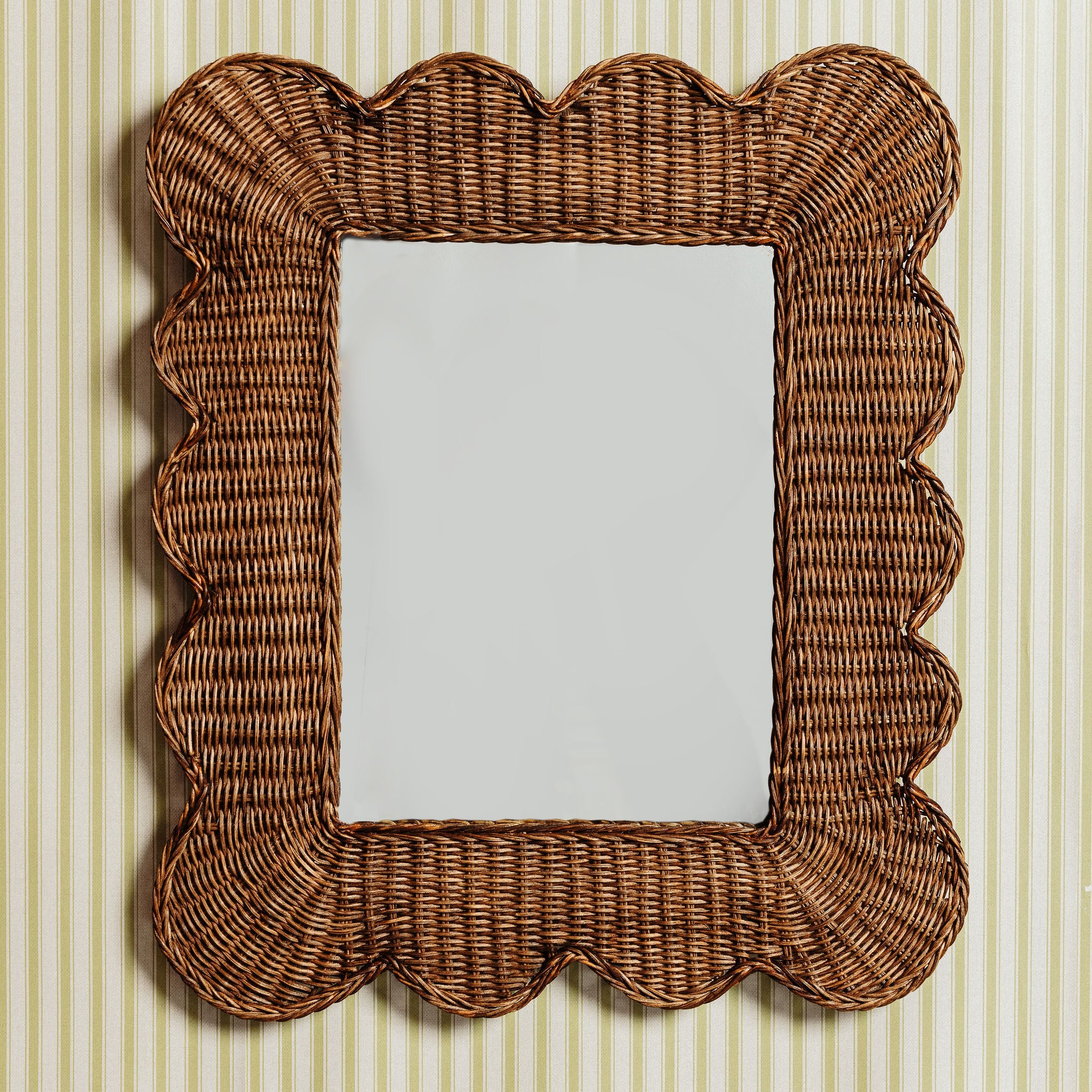Mimi-scalloped-mirror-medium-teak-on-a-wall