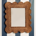 Mimi-scalloped-mirror-medium-teak-on-a-wall