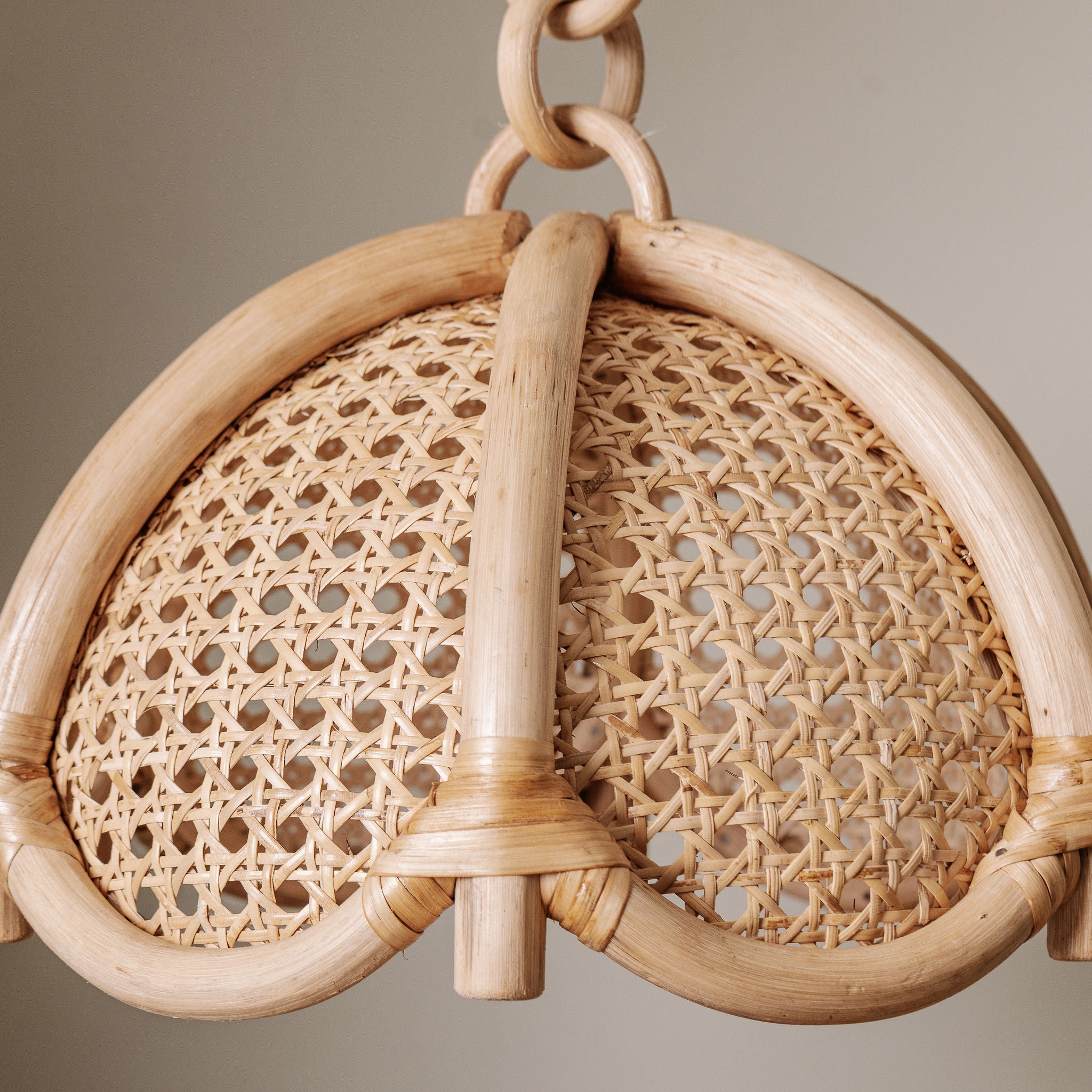 Riviera woven wooden pendant light with a neutral background