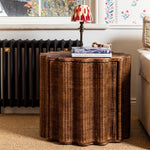 Ruby Wicker side table with lamp and books in a room setting