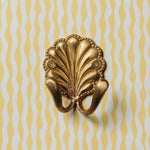 SHELL-BRASS-WALL-HOOK-DOUBLE-ON-A-WALL