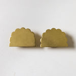 Scallop-knobs-Lacquered-brass-on-a-cabonet