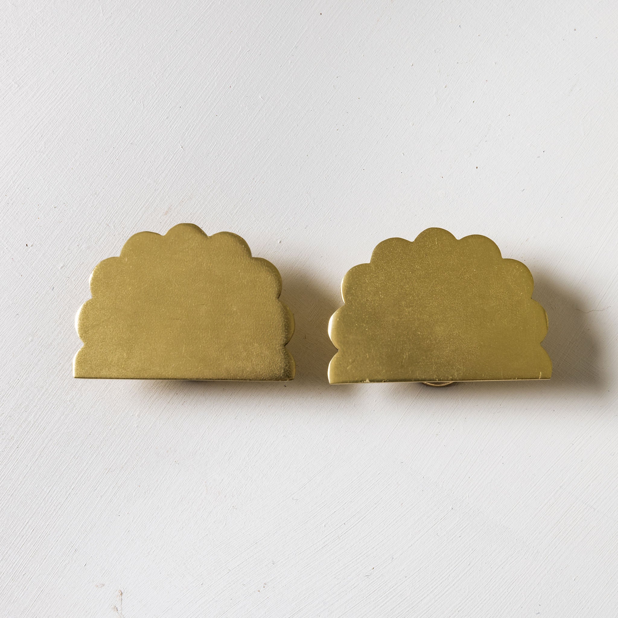 Scallop-knobs-Lacquered-brass-on-a-cabonet