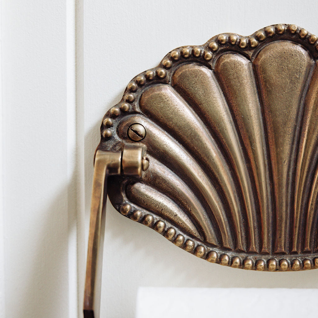 Shell-toilet-roll-holder-aged-brass-close-up