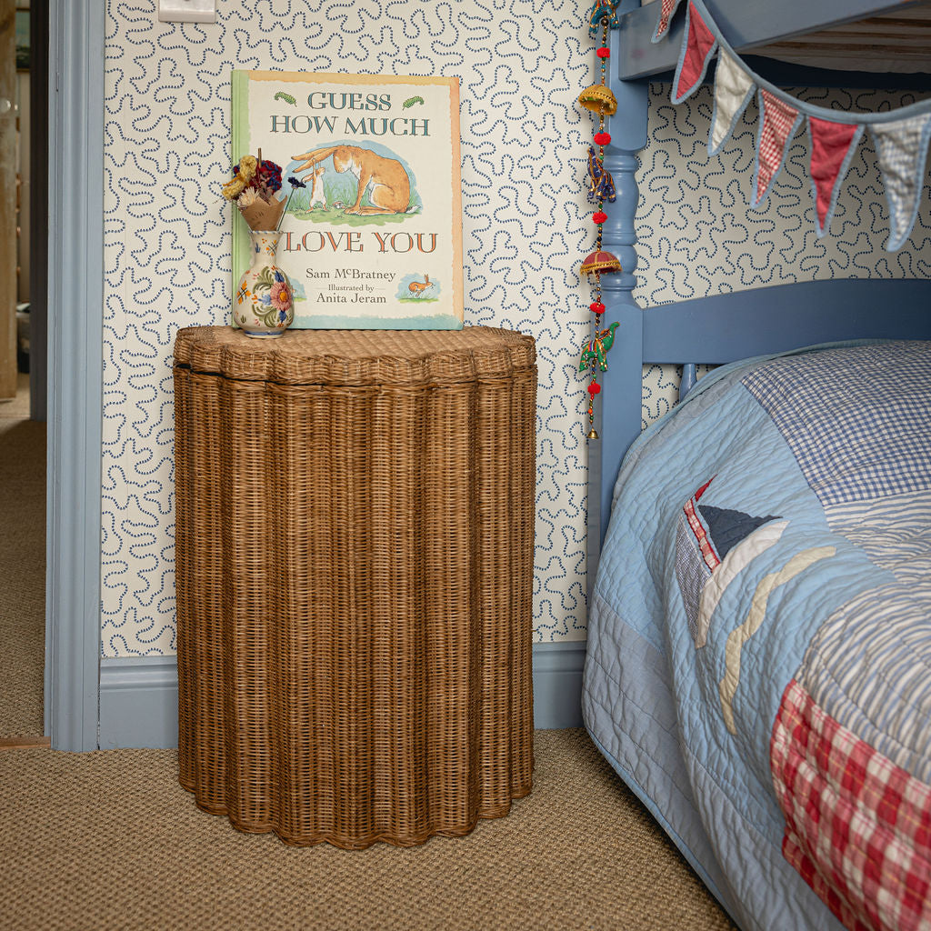 Shell Rattan Side Table, Oak by bed