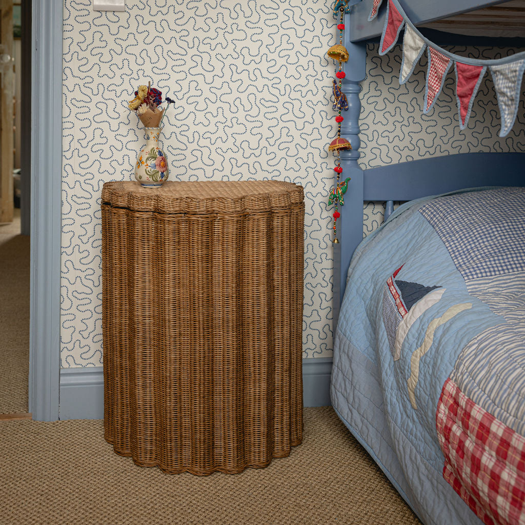 Shell Rattan Side Table, Oak by bed