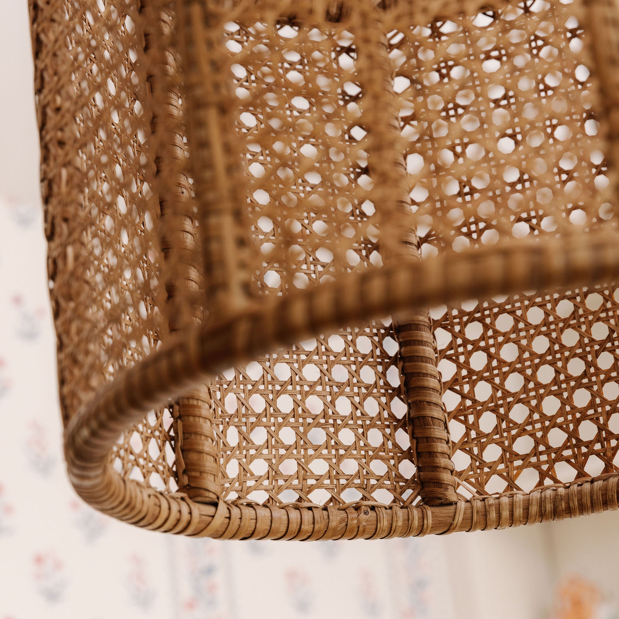 Close-up of a violet woven wicker chair with a blurred background
